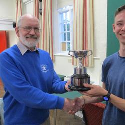 Jack Knowles receives the winners cup after Steeple Aston win the 2022 method striking competition in Horley